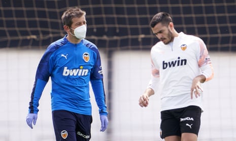 The Valencia manager, Albert Celades (left), takes training on Monday. The La Liga clubs are largely back on the training ground - in small groups under the strictest regulations.