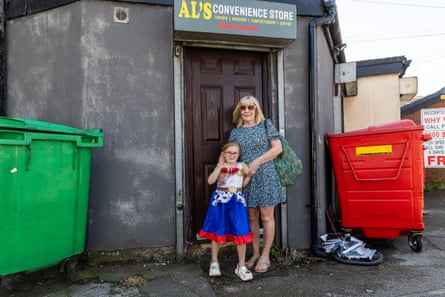 Eilieen Orrell with her granddaughter outside a doorway near Hindley High Street.