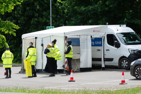 Staff at a mobile testing centre in Slough today, where surge testing is taking place.