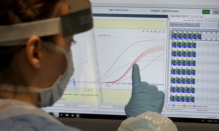 A technician at the Covid-19 testing lab at Queen Elizabeth University hospital in Glasgow