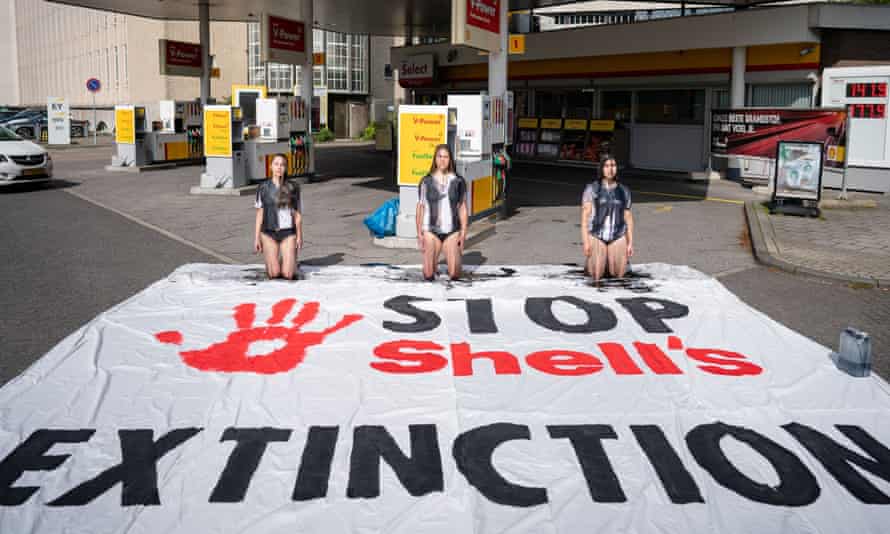Extinction Rebellion campaigners demonstrate at a Shell station in The Hague.
