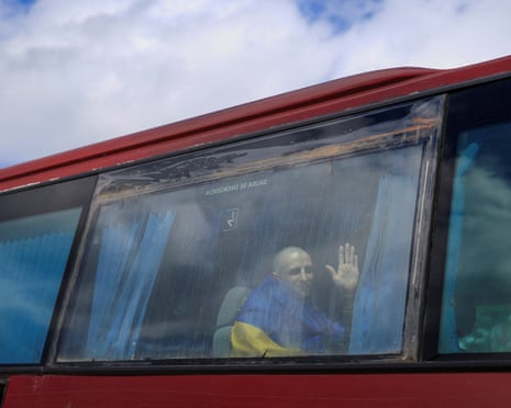 A Ukrainian prisoner of war waves after a swap, amid Russia's aggression on Ukraine.