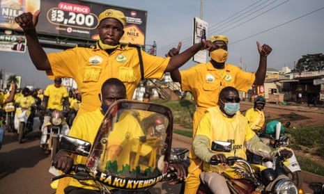Supporters of incumbent Ugandan president Yoveri Museveni celebrate in the streets of Kampala.