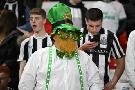 A Newcastle fan joins in the St Patrick's Day celebrations.