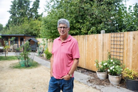 Bishop Martin Gorick posing for the camera in a garden.