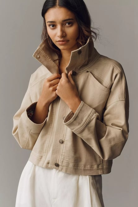 woman wearing tan jacket