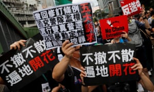 Anti-extradition bill protesters march to West Kowloon railway station in Hong Kong