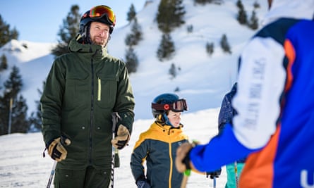 Dad and child in ski gear