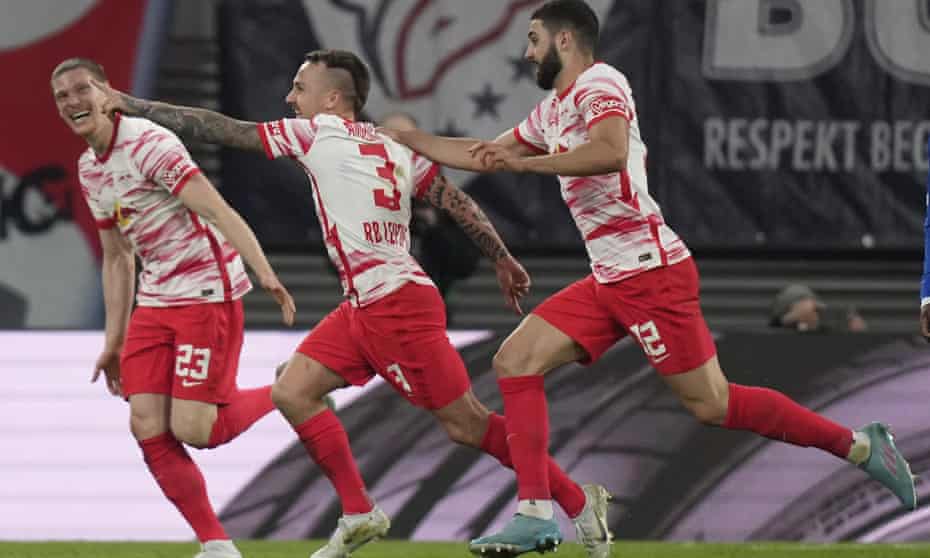 Angeliño (centre) celebrates with Josko Gvardiol (right) and Marcel Halstenberg after scoring for RB Leipzig
