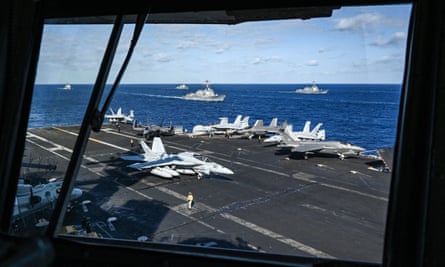 Jet fighters and ships are seen from the bridge of the USS Carl Vinson aircraft carrier during a three-day maritime exercise between the US and Japan in the Philippine Sea in January 2024