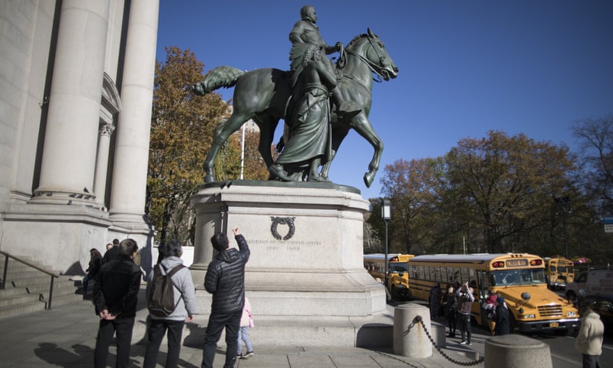 Protesters have demanded the removal of a statue outside the American Museum of Natural History featuring Theodore Roosevelt flanked by an African American and a Native American.
