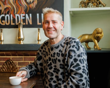 Jamie Jewell sitting with a hot drink in his pub