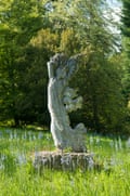 A marble statue of Daphne by Simon Verity at Batsford Arboretum in Gloucestershire.