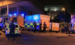 Armed police at Manchester Arena after reports of an explosion at the venue during an Ariana Grande gig.