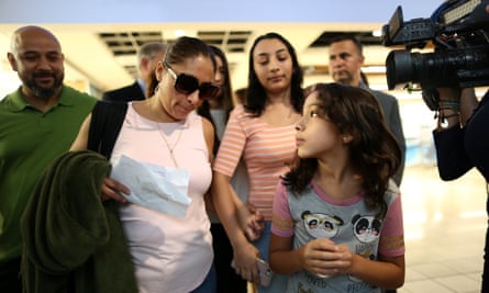 Alejandra Juarez walks with her two daughters, Pamela, 16, and Estela, 9, and her husband Temo Juarez, a former US Marine, to the departure gates at Orlando international airport for her deportation flight to Mexico.