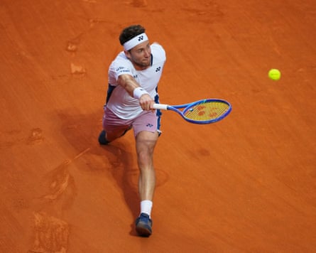 Casper Ruud plays a shot