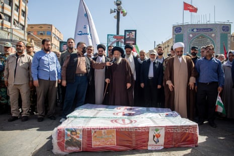 Mourners attend a funeral for those killed in Israeli strikes on Iran, in Ahvaz, Iran, 19 June 2025.