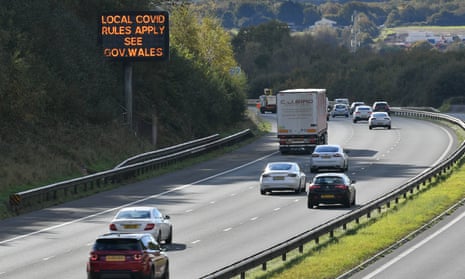A sign on the M4 near Cardiff reminds motorists of coronavirus rules.