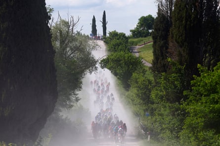 Riders battle along the dusty white roads in Tuscany