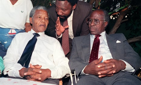 Nelson Mandela and Andrew Mlangeni listening to a young Cyril Ramaphosa in 1990