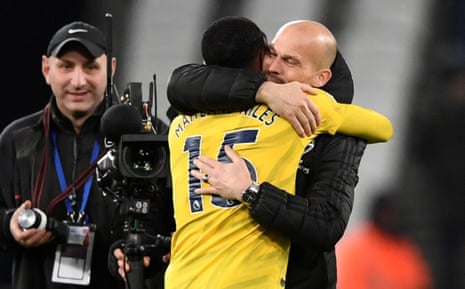 Ainsley Maitland-Niles and Freddie Ljungberg celebrate after the match.