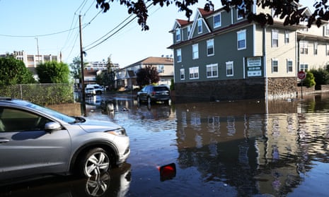 A stranded car in flood water is seen on Lester Street on Thursday in Passaic City, New Jersey.