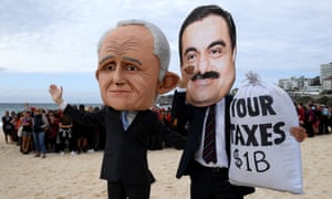 Protesters depict Malcolm Turnbull and the Adani founder.