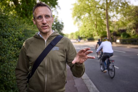 Justin McKie speaking in the Outer Ring as cycles travel past