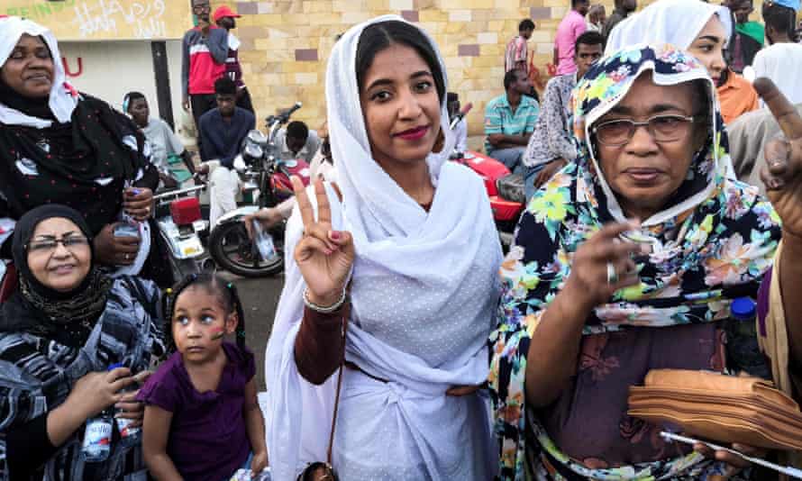 Alla Salah, whose protest against Bashir propelled her to internet fame, flashes a victory sign in Khartoum on Wednesday.