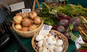 English and Chinese produce for sale at farmer and greengrocer Keith Lessiter's stall in Fishguard Market, Fishguard, Wales.