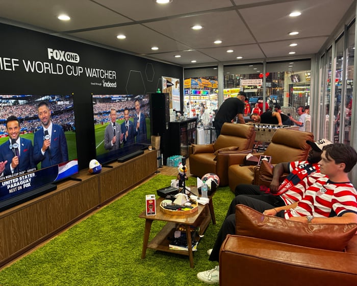 ‘The perfect job’: meet the fans being paid to watch all 104 World Cup games in Times Square