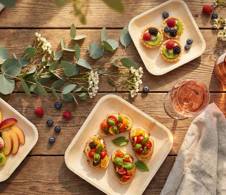 bamboo plates of food on wooden table