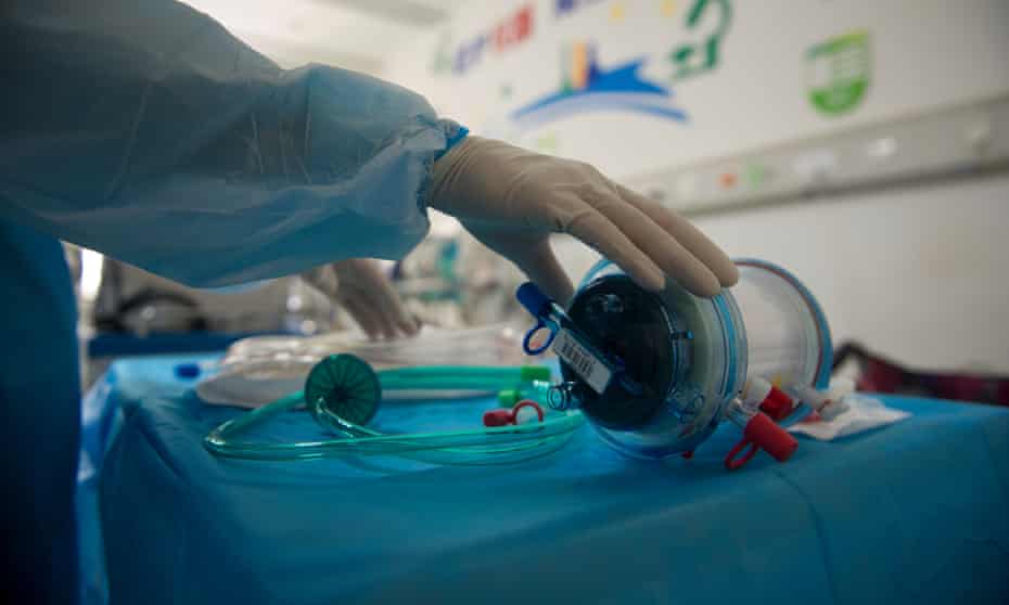 A nurse in Wuhan, China, works in an intensive care unit where ECMO treatment is used for Covid-19 patients.