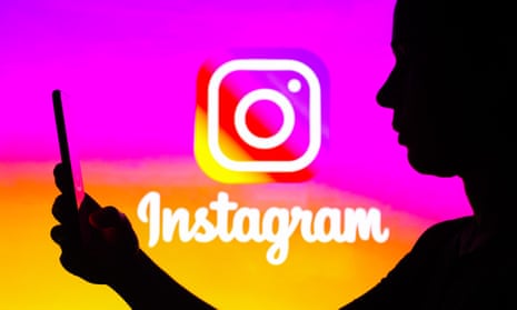 Photo illustration of a silhouette of a woman looking at a mobile phone in front of an Instagram logo background.