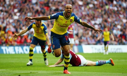 Theo Walcott celebrates after scoring against Aston Villa in the FA Cup final