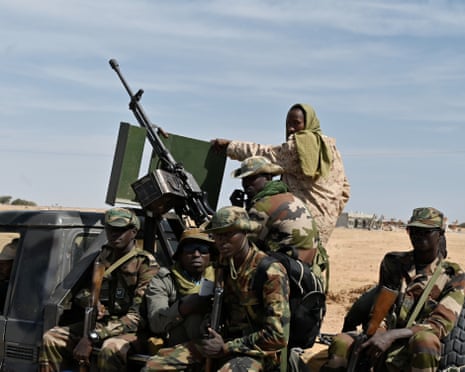 Nigerian soldiers patrol outside the Diffa airport in south-east Niger, near the border