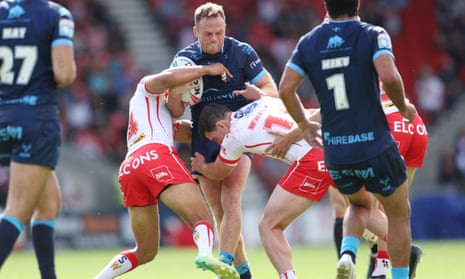 Hull KR's Joe Burgess takes on the St Helens defence.