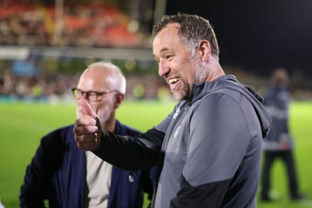 Grimsby’s manager, David Artell, savours his team’s victory, with Jason Stockwood closeby.