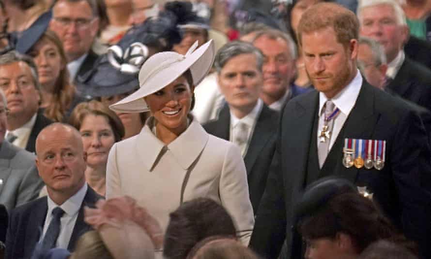 Prince Harry and Meghan, Duchess of Sussex, head to their seats in St Paul’s Cathedral