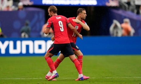 Jordan Henderson takes the captain's armband from Harry Kane.