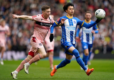 Brighton v Grimsby: FA Cup quarter-final – live | FA Cup 1 Harry Clifton and Kaoru Mitoma battle for the ball.