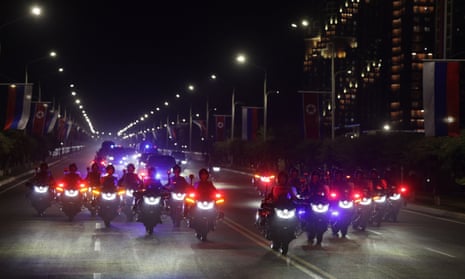 The motorcade of Russian President Vladimir Putin and North Korean leader Kim Jong-un drives through Pyongyang.