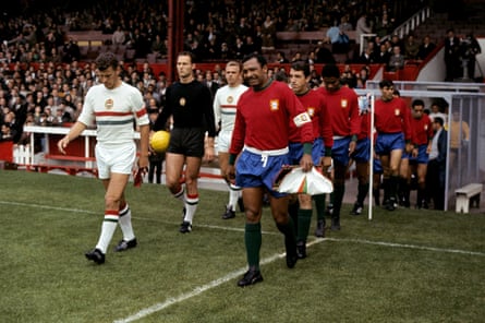 Hungary’s Ferenc Sipos and Portugal’s Mario Coluna lead their teas out at old Trafford during the 1966 World Cup.