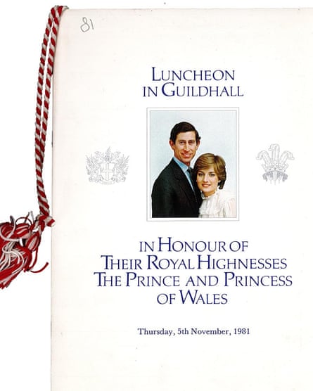 The printed menu for a lunch in honour in honour of then Prince Charles and Princess Diana, featuring a picture of them and a tassle