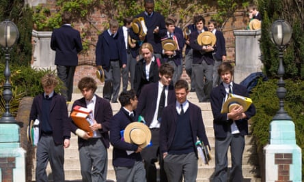 A group of pupils walking down steps in the school grounds
