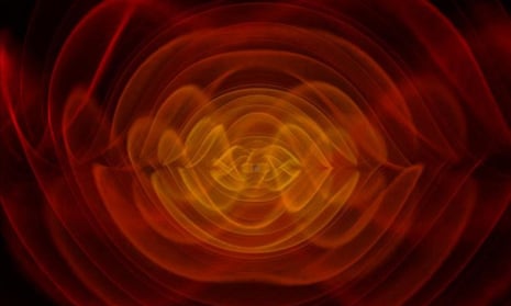 This is a computer simulation of the gravitational waves emitted by two gigantic black holes spiralling around each other.