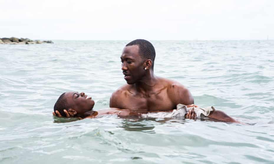 Alex Hibbert as the young Chiron with Mahershala Ali in Moonlight.
