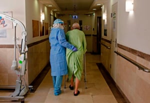 A medic assists a patient at the Covid-19 isolation ward of Meir Medical Center in Kfar Saba, near the Israeli coastal city of Tel Aviv, on 9 September, 2020.