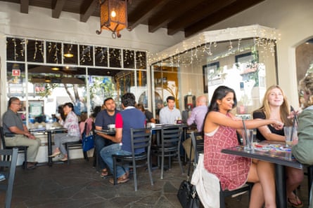 Diners eat outdoors at Coupa Cafe in a 2016 file photo in the Silicon Valley town of Palo Alto, California.