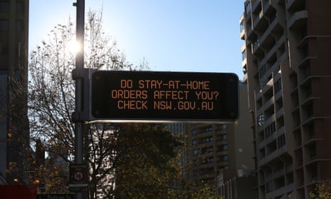 A government message on a digital sign on Oxford Street ahead of lockdown restrictions being imposed in Sydney
